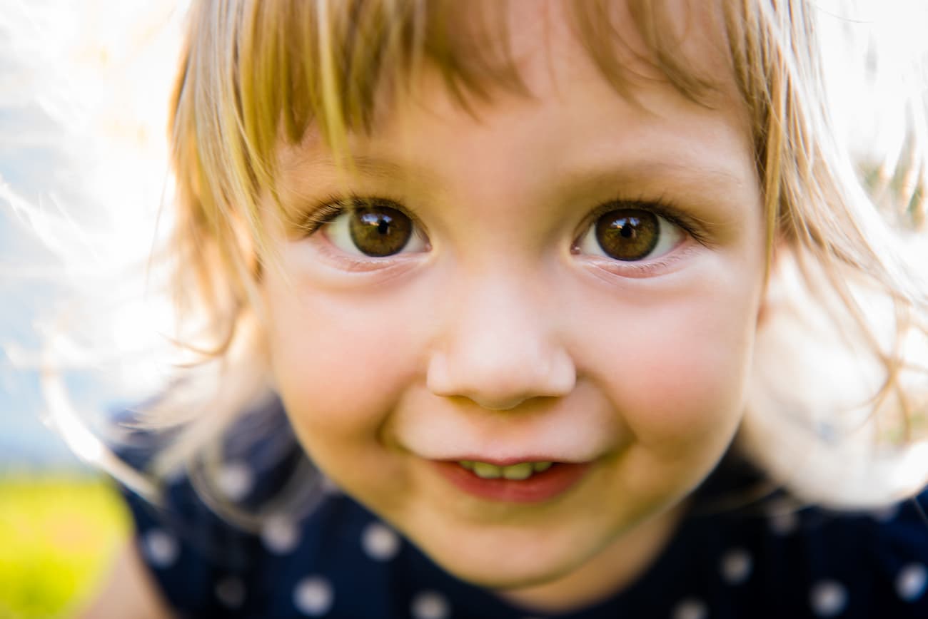 A little girl staring into the camera