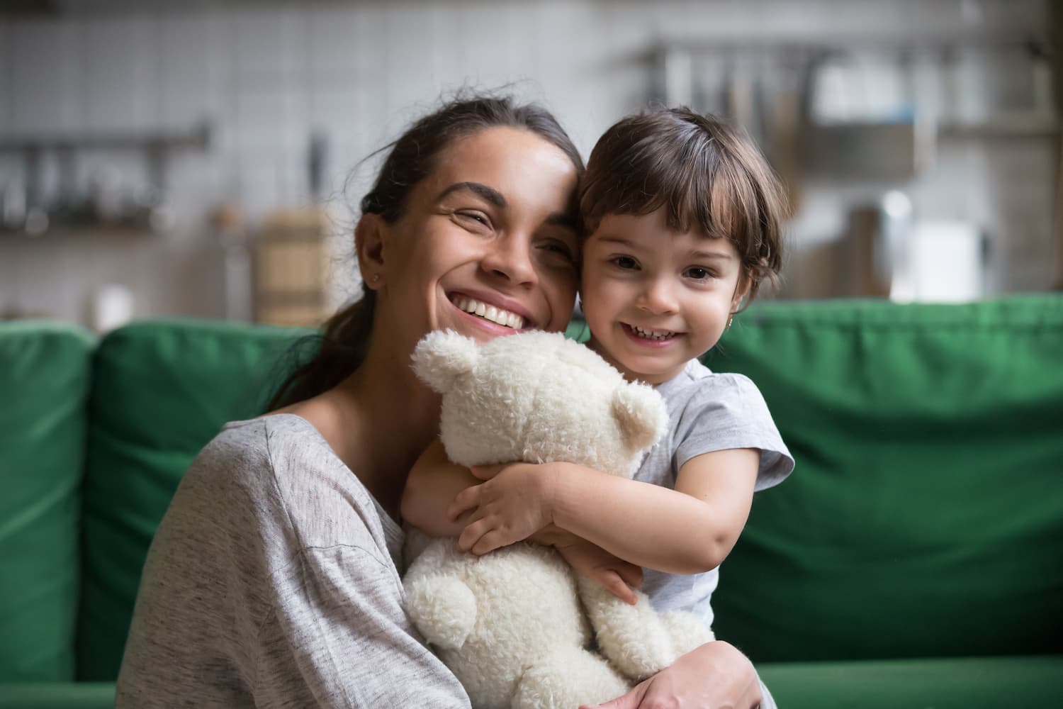 Smiling mother hugging her child