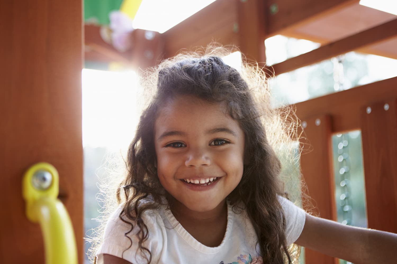 a little girl in a play park