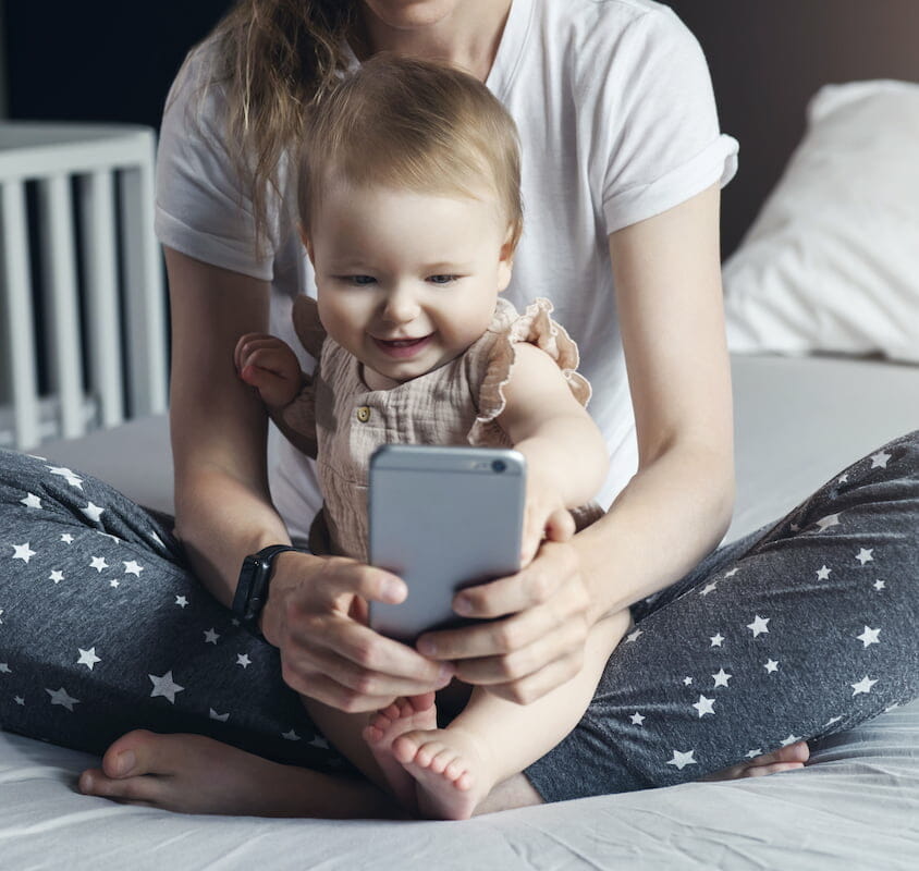 a mother and baby on facetime