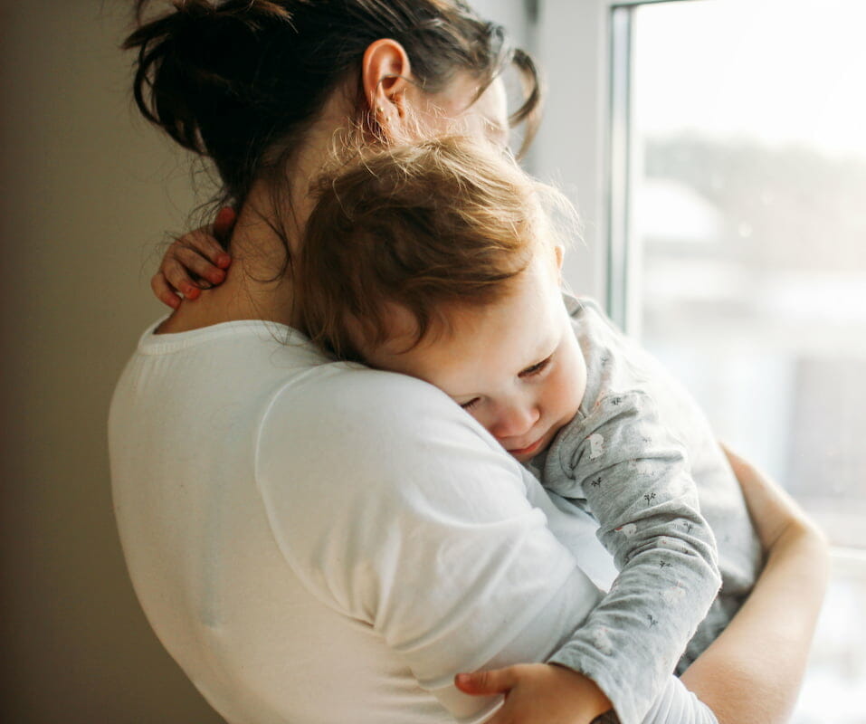 a child hugging their mother
