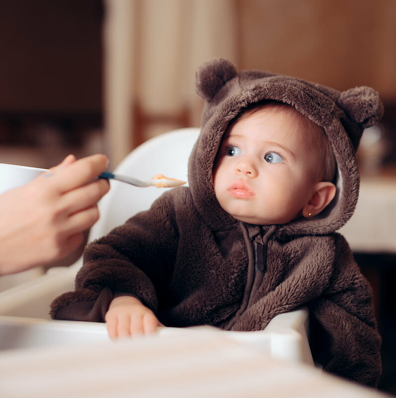 a baby being fed