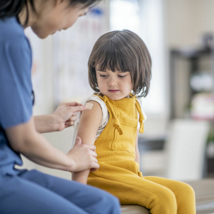 A child with a plaster on their arm