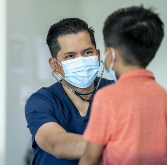 A child being examined by a paediatrician